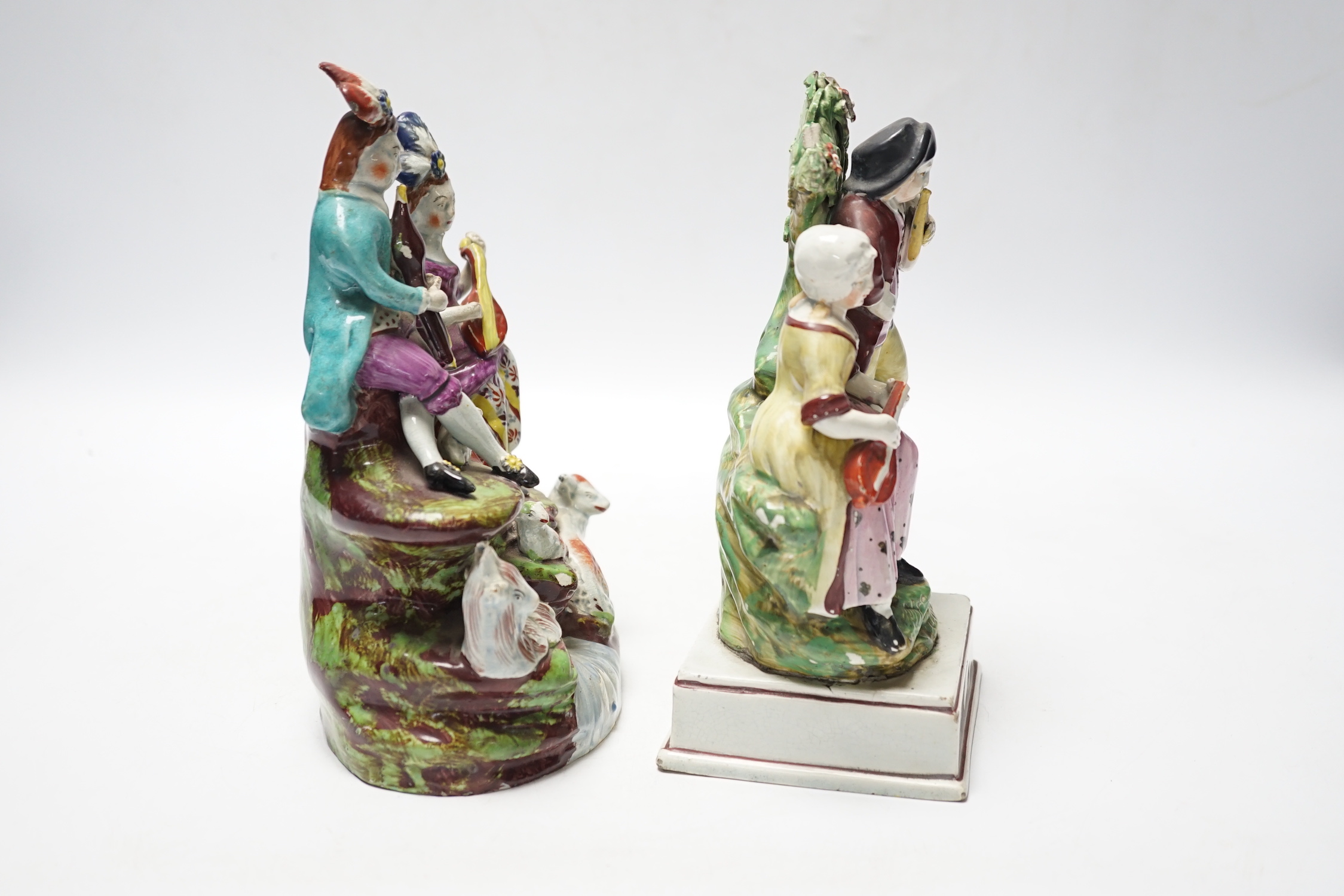 Two Staffordshire pearlware groups of musicians, c.1810-25, largest 20cm high